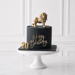 Tort aniversar negru cu leu auriu și cifră personalizată